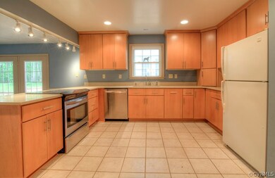 Recessed lights, tile floors, open to both dining room and family room