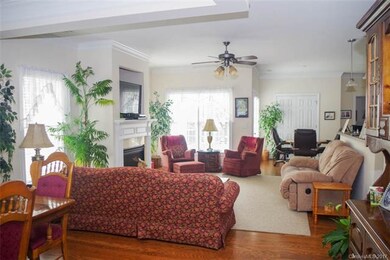 Living room is open and bright with lots of window
