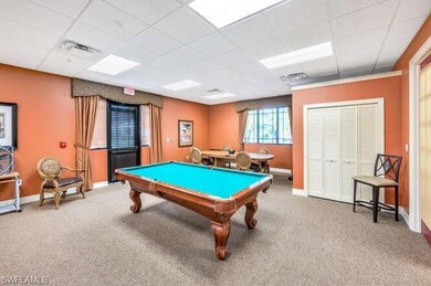 Rec room with a drop ceiling, pool table, and carp