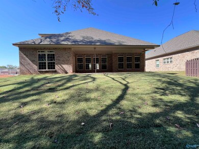 Enjoy serene views from your covered veranda, overlooking a lush backyard and wooded area. Perfect for sipping morning coffee or an afternoon glass of wine while immersed in nature's tranquility.