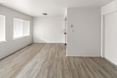 Spare room with light wood finished floors and baseboards