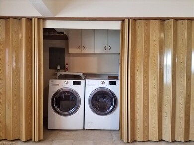 First floor laundry with newer washer and dryer.