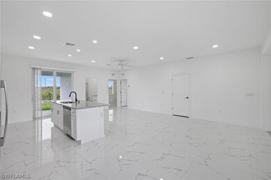 Kitchen featuring stainless steel dishwasher, ligh
