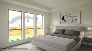 Carpeted bedroom with multiple windows