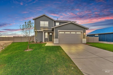 Traditional home featuring concrete driveway