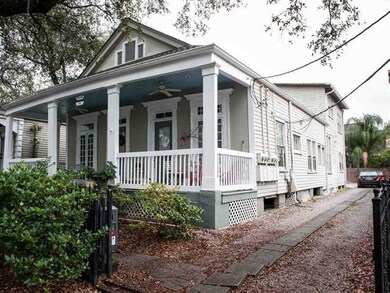 Facade/Exterior Front. Driveway to rear parking &