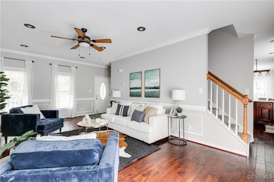 Open-concept living room with fireplace and direct sightlines into the kitchen — offering an ideal layout for modern living