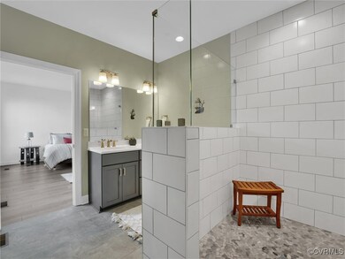 Bathroom with a shower, vanity, hardwood / wood-st