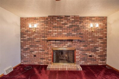 Enjoy the comforts this Gas Log Brick fireplace ha