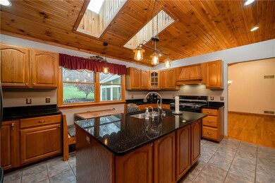 The kitchen continues with the rich, warm tones wi