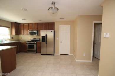 Kitchen with appliances with stainless steel finis