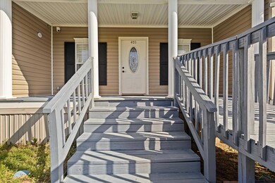 View of exterior entry with a porch
