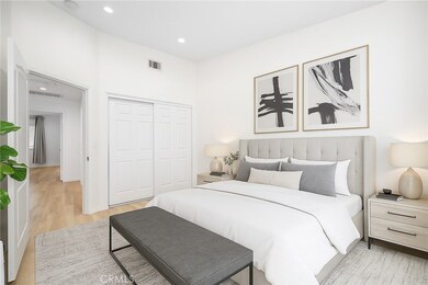 Virtually staged second bedroom with plenty of space for a queen bed.  Large closet and recessed lighting.