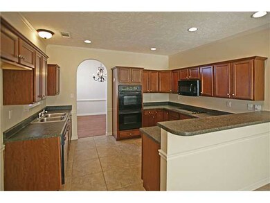 Massive kitchen with double ovens, smooth cooktop,
