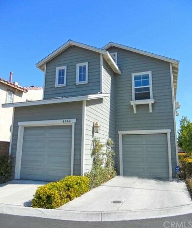 Back of house with two separate garage entrances, 