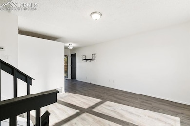 Empty room featuring hardwood / wood-style floors 