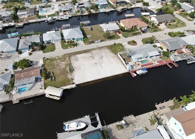 Bird's eye view featuring a water view and a resid