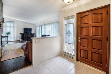 Entry way is spacious for welcoming guests and lar