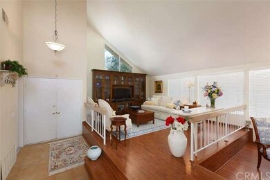 Double door entry with high vaulted ceilings. 