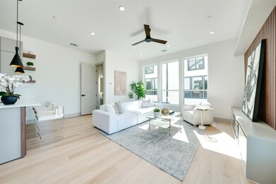 Living room with light hardwood / wood-style floor