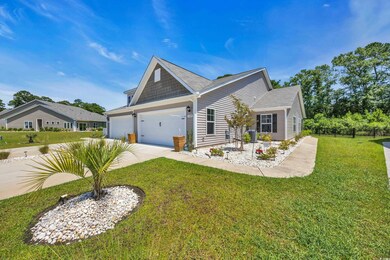 View of front of house featuring concrete driveway and a garage