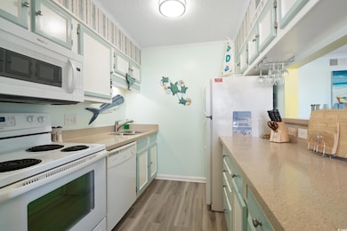 Kitchen featuring ornamental molding, a textured c