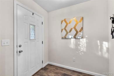 The entryway includes a convenient coat closet to keep shoes and outerwear out of sight.