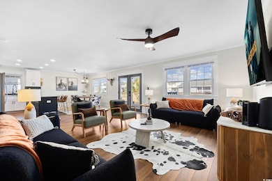 Living room with light hardwood / wood-style floor