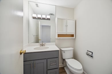 This powder room bath is located near the entry do