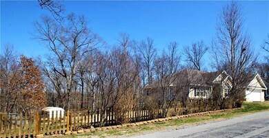 Yard is fenced for whatever your needs might be:  Grown up play, kid play or puppy play.  In another week, you will see the beautiful yellow Forsythias blooming amount the pretty redbud trees.