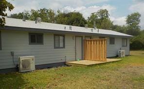 Back of property featuring a yard