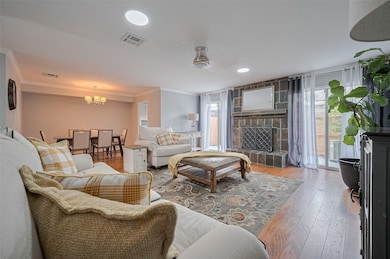 Spacious living room with a cozy fireplace, perfec