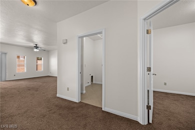 Unfurnished room with ceiling fan, carpet flooring