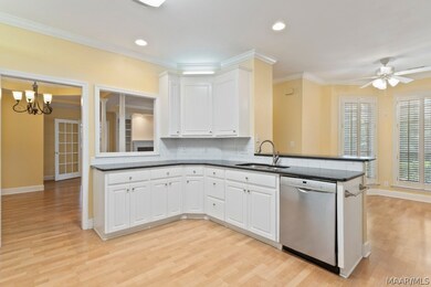 Kitchen is open to breakfast room, dining room, an