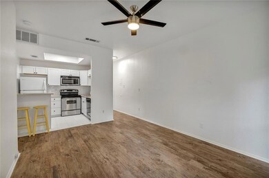 Unfurnished living room with light wood-style flo