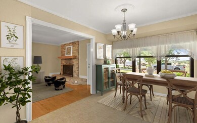 Dining room with a chandelier, a fireplace, ornam
