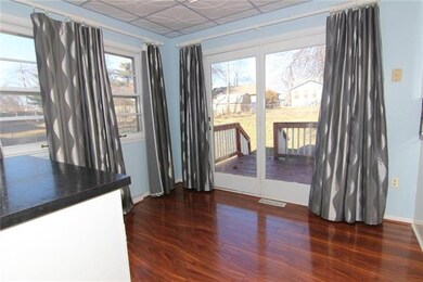 Door off kitchen leads to deck and huge backyard.