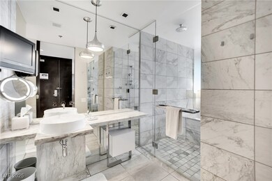Full bathroom featuring a stall shower, a sink, an