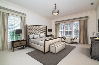 Large master suite overlooks backyard and offers h