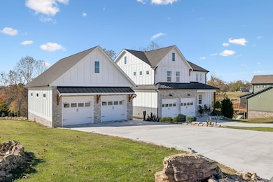 Front view with 26x34 oversized detached 2 car garage .