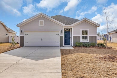 Ranch-style house with an attached garage, board a