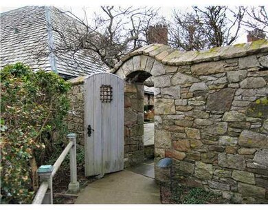 Exterior Front. ENTRY GATE FROM PARKING AREA