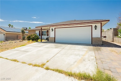 Single story home featuring an attached garage, co