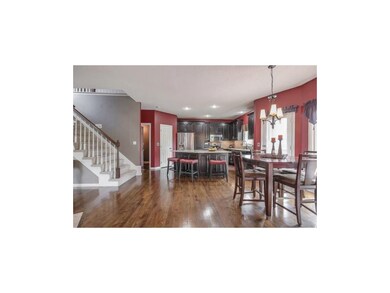 Breakfast area and Kitchen with hardwood flooring.