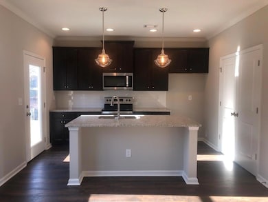 Kitchen featuring stainless steel appliances, a we