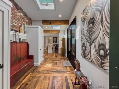 Reclaimed Hardwood Floor with two coat closets