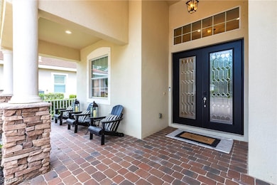 Entrance to property with stucco siding, french do
