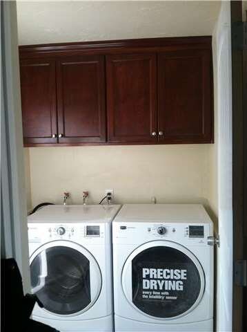 New Washer and Dryer with storage cabinets above!