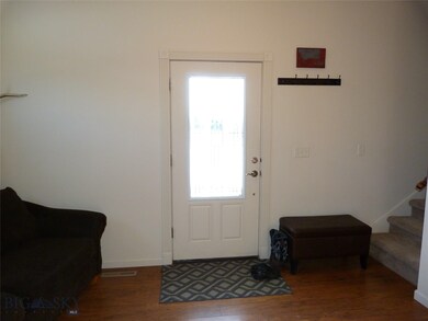Front Door enters living room and stairs to 2nd fl