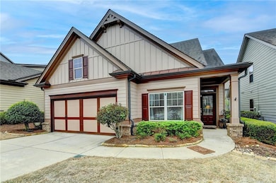 Craftsman-style house featuring an attached garage